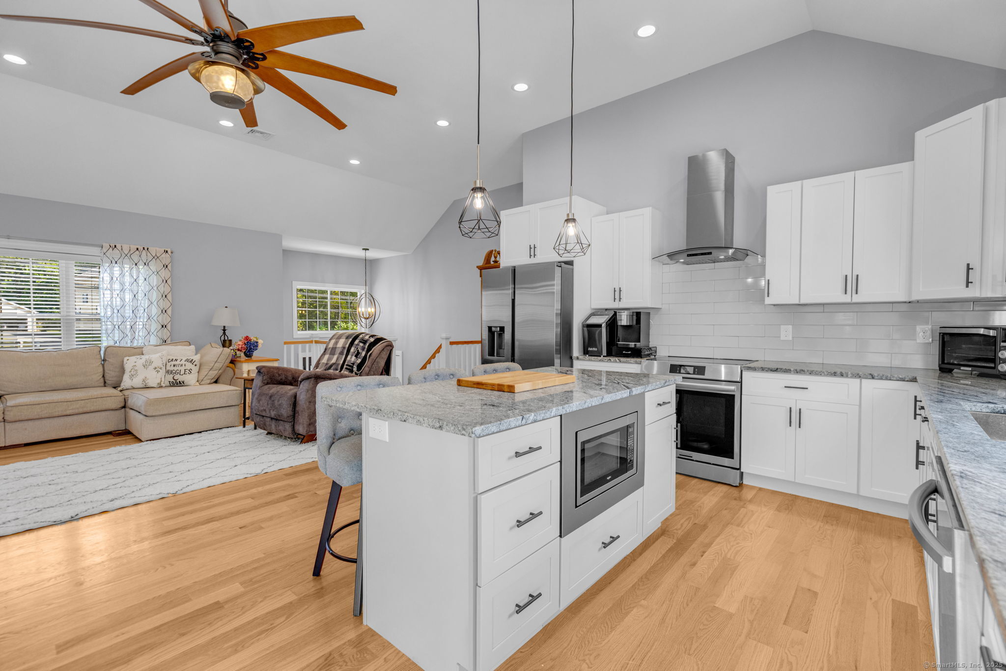 1209 Woodtick Road Wolcott, CT 06716 - Photo 11 of 40 a kitchen with stainless steel appliances granite countertop a stove and a white cabinets