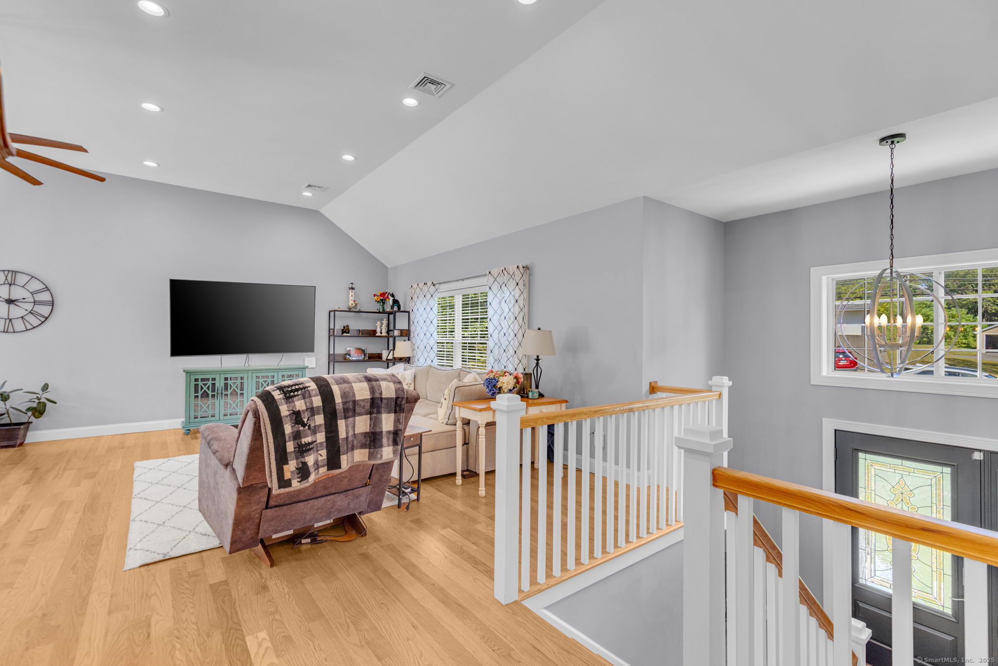 1209 Woodtick Road Wolcott, CT 06716 - Photo 12 of 40 a living room with furniture and a flat screen tv
