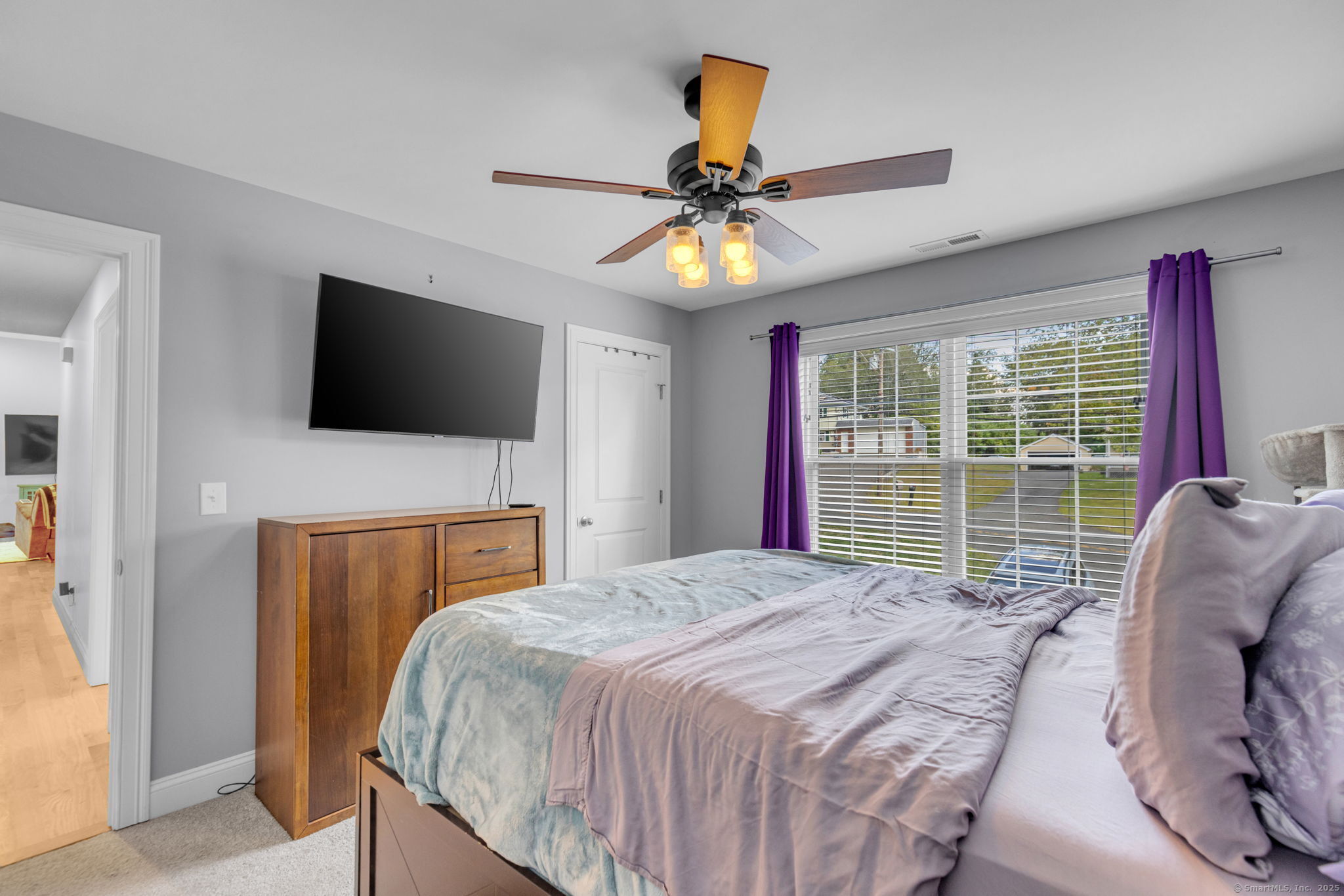 1209 Woodtick Road Wolcott, CT 06716 - Photo 21 of 40 a bedroom with a bed and a flat screen tv