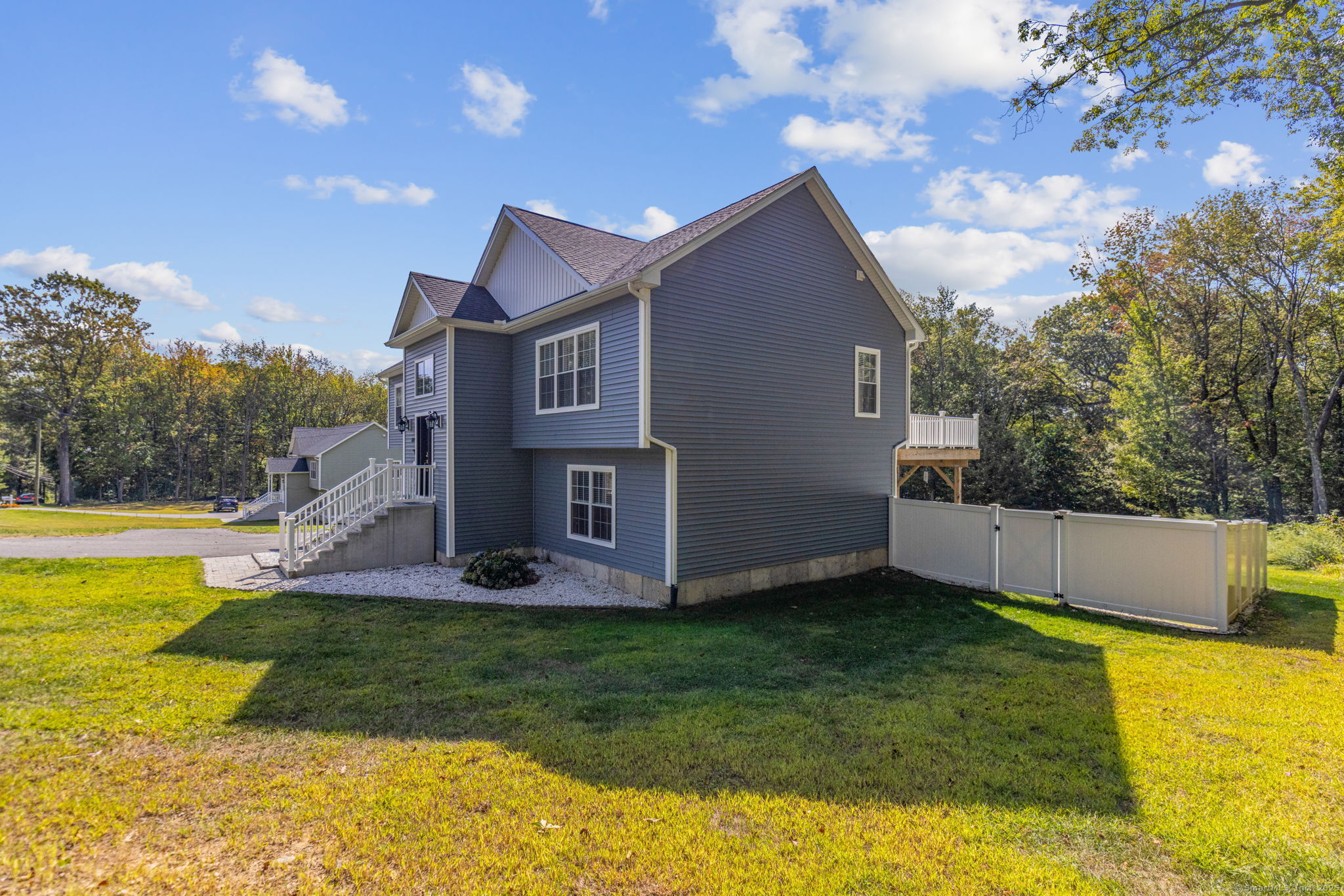 1209 Woodtick Road Wolcott, CT 06716 - Photo 30 of 40 a view of a house with a yard