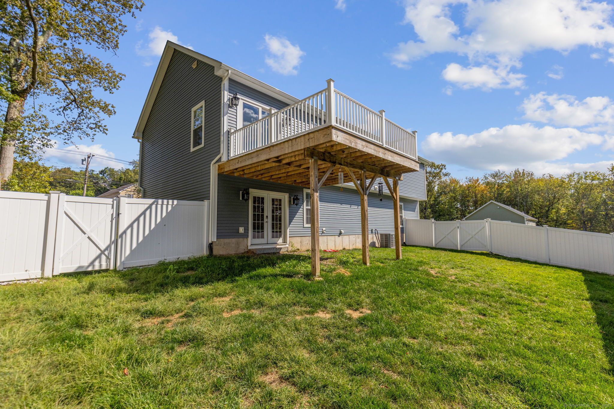 1209 Woodtick Road Wolcott, CT 06716 - Photo 31 of 40 a view of a house with a yard