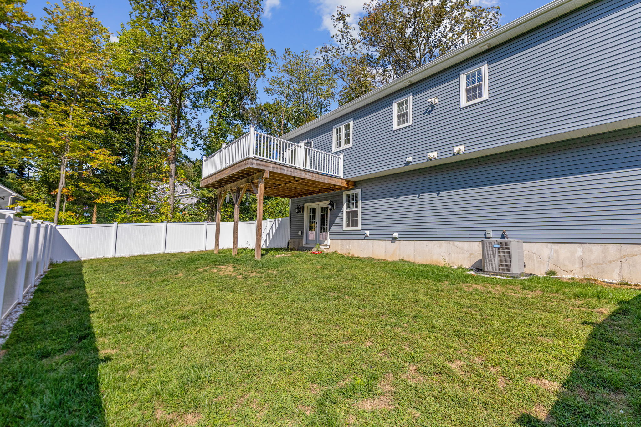 1209 Woodtick Road Wolcott, CT 06716 - Photo 32 of 40 a backyard of a house with table and chairs
