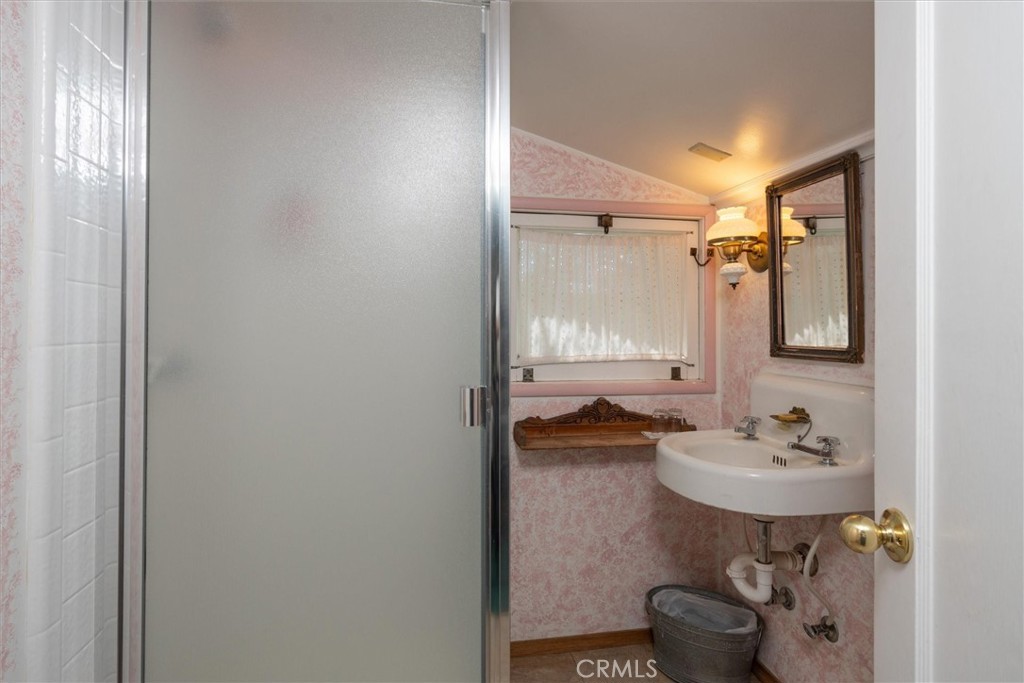 2669 Triangle Road Mariposa, CA 95338 - Photo 44 of 58 a bathroom with a sink and a mirror