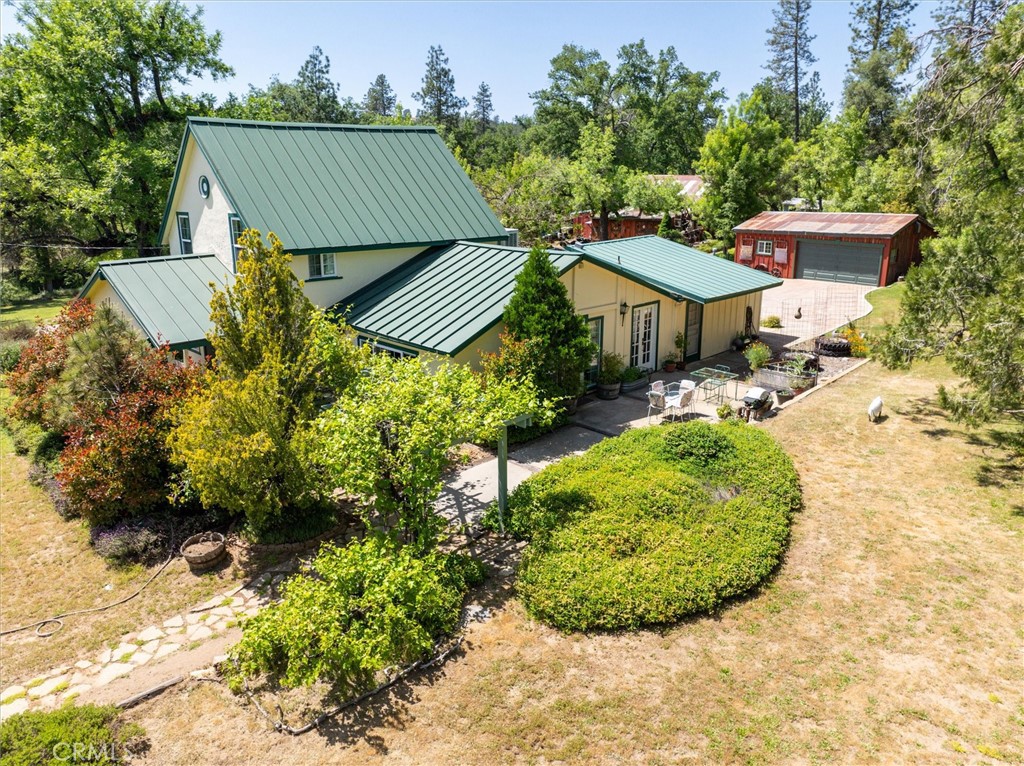 2669 Triangle Road Mariposa, CA 95338 - Photo 5 of 58 a view of a swimming pool with a patio and plants