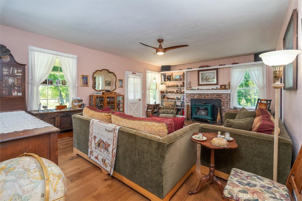2669 Triangle Road Mariposa, CA 95338 - Photo 10 of 58 a living room with furniture and a fireplace
