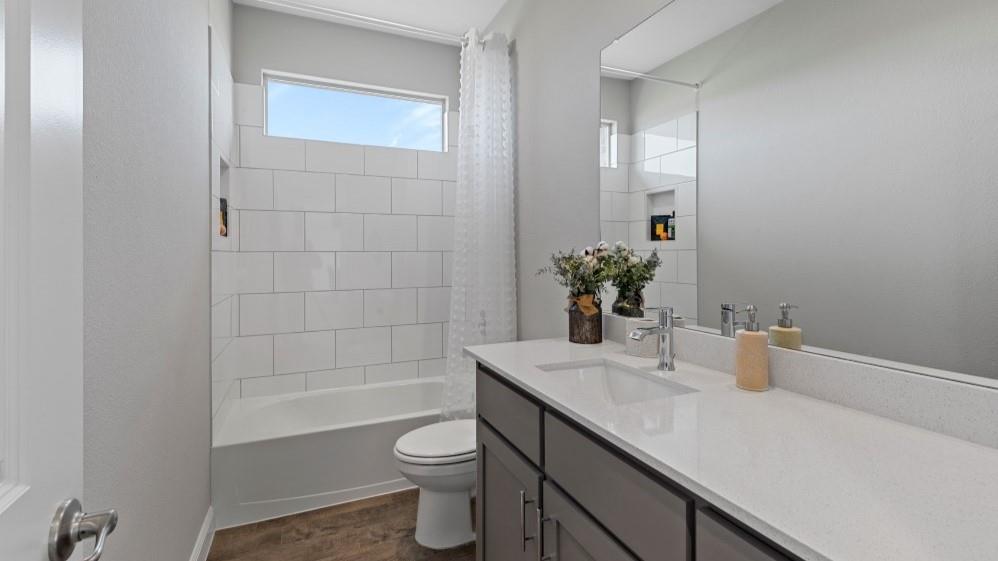 231 Windmill Drive Rhome, TX 76078 - Photo 21 of 30 a bathroom with a sink a toilet and shower