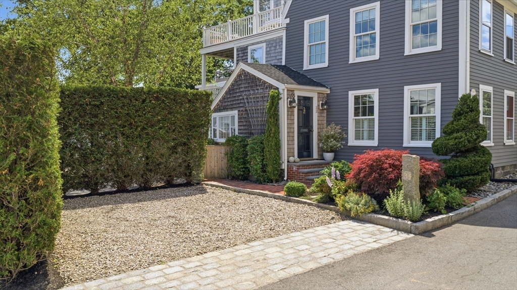 33 Franklin Street Marblehead, MA 01945 - Photo 5 of 42 front view of a house with a bench