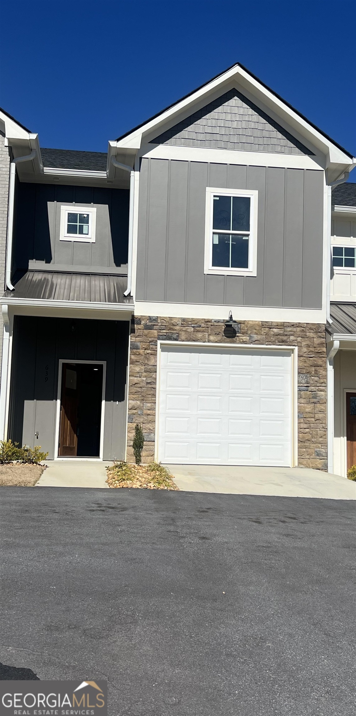 639 East 3rd Street, Unit 18 Rome, GA 30161 - Photo 1 of 1 a front view of a house with a garage