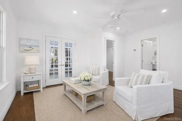 a living room with furniture and white walls