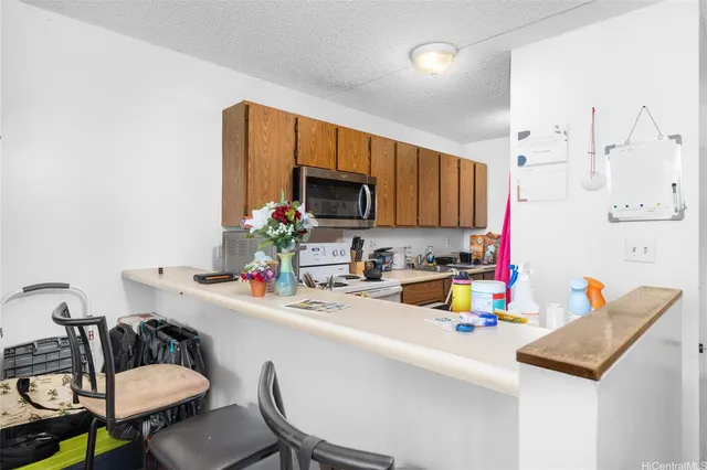 a kitchen with a sink cabinets and appliances