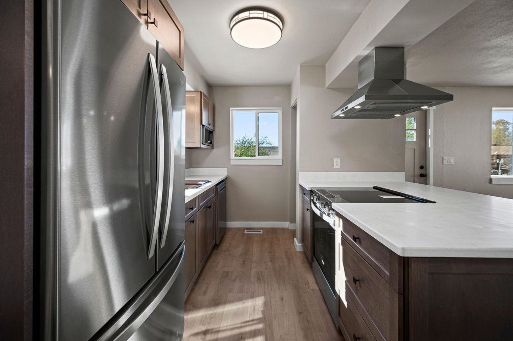 508 Rosa Street Palisade, CO 81526 - Photo 6 of 18 a kitchen with stainless steel appliances granite countertop a refrigerator a stove and a sink