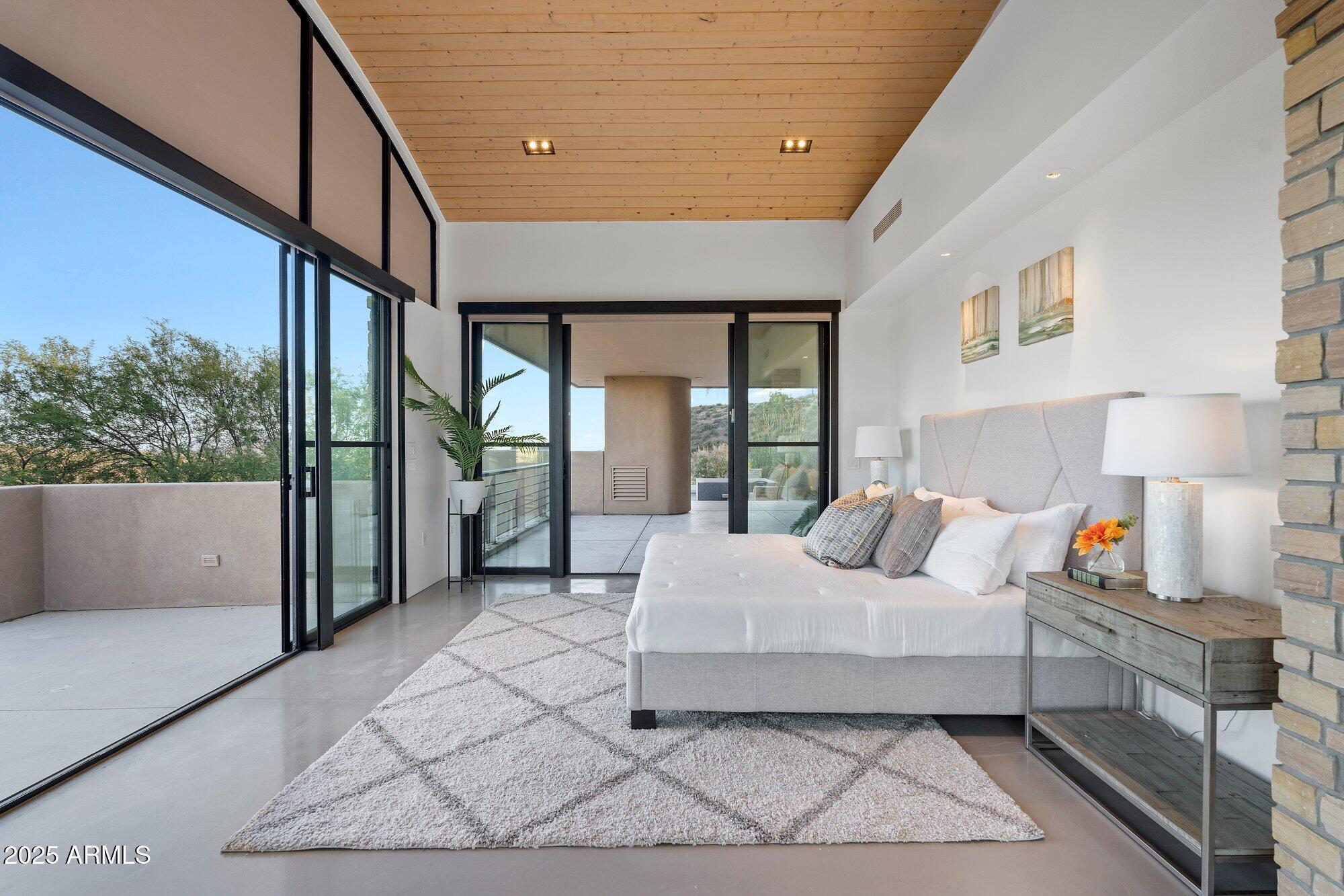 9626 East Aw Tillinghast Road Scottsdale, AZ 85262 - Photo 15 of 28 a bedroom with a large bed and a large window