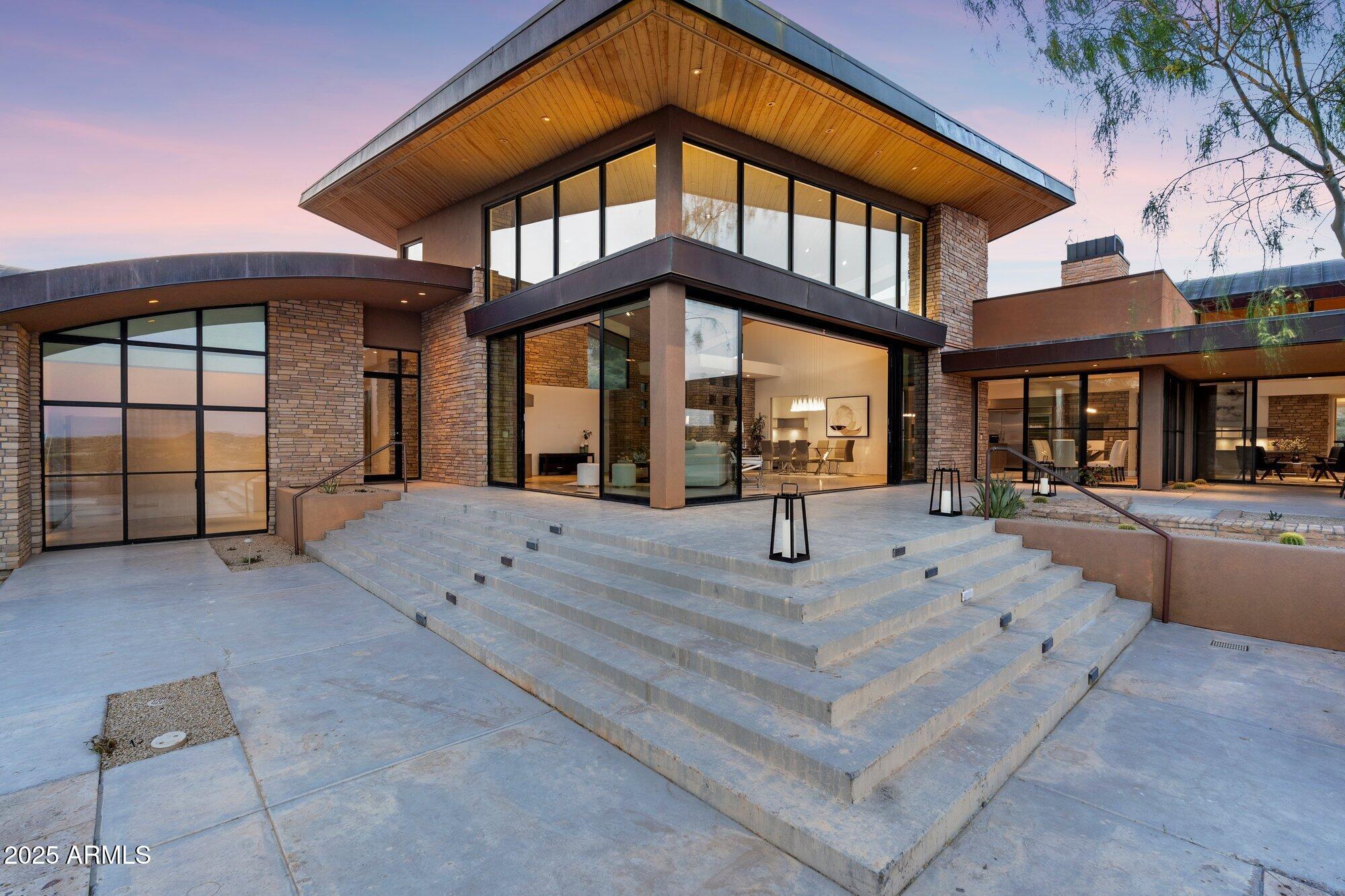 9626 East Aw Tillinghast Road Scottsdale, AZ 85262 - Photo 23 of 28 a view of a house with a backyard and windows