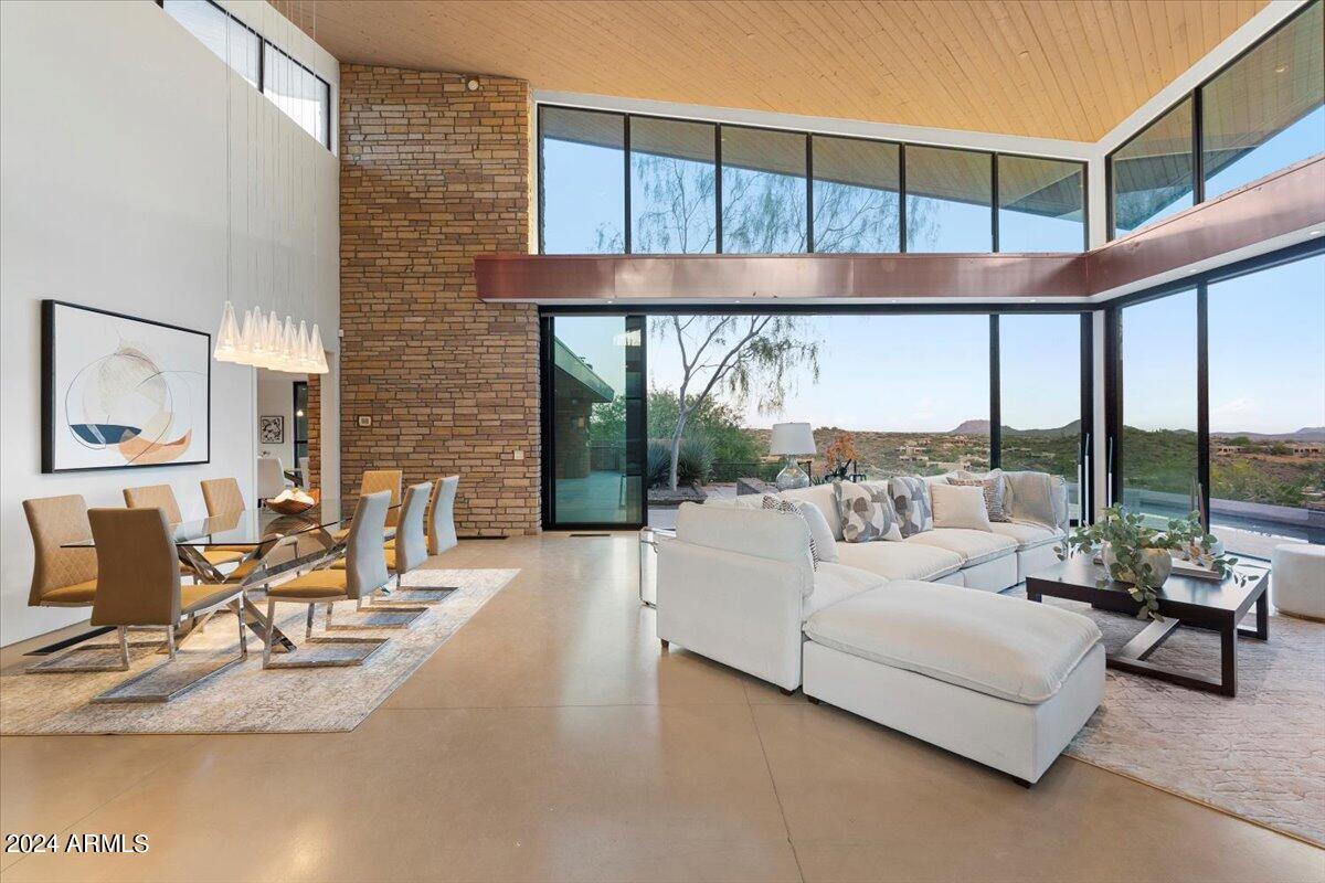 9626 East Aw Tillinghast Road Scottsdale, AZ 85262 - Photo 6 of 28 a living room with furniture and a large window