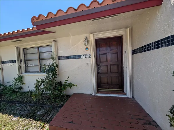 a view of a entryway door front of house