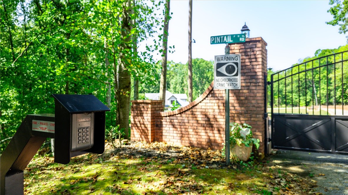 Tbd Tbd Pintail Road Anderson, SC 29626 - Photo 8 of 18 A secure gated entrance features brick pillars and an electronic keypad entry system.