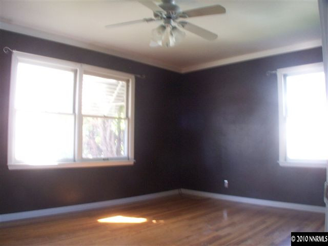 920 Bates Avenue Reno, NV 89502 - Photo 3 of 13 a view of an empty room with wooden floor and a window