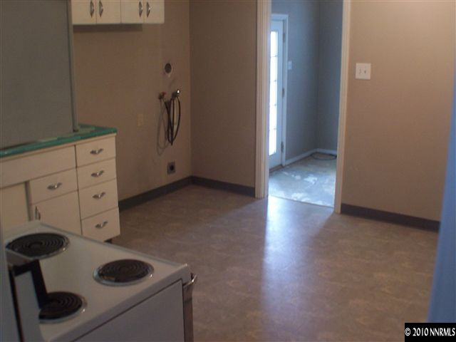 920 Bates Avenue Reno, NV 89502 - Photo 5 of 13 a kitchen with a refrigerator and cabinets