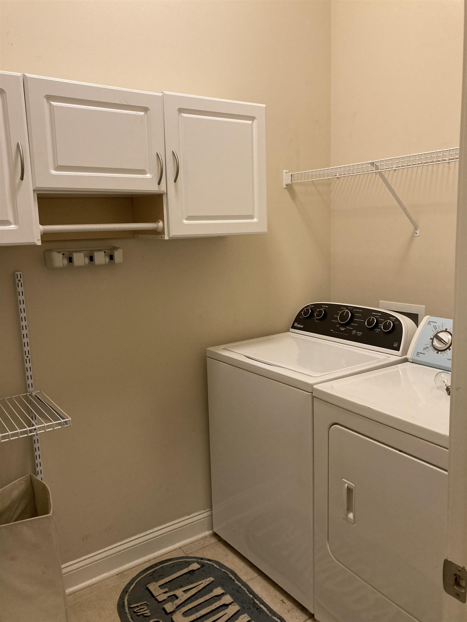 812 Historian Street Raleigh, NC 27603 - Photo 14 of 45 Main floor with built in shelves for extra storage ceramic tile Laundry room