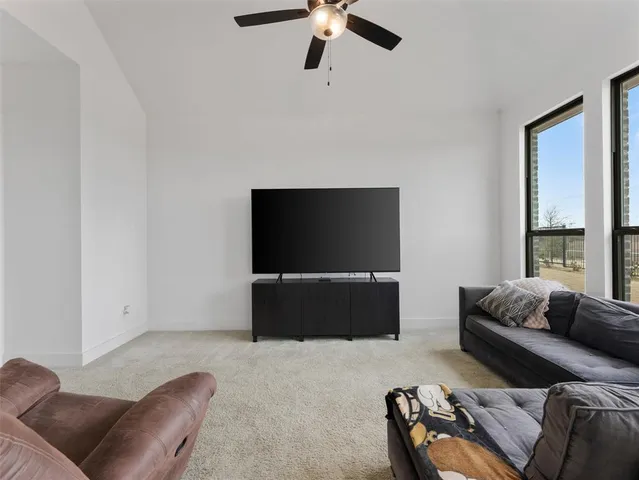 a bedroom with a bed and a flat tv screen