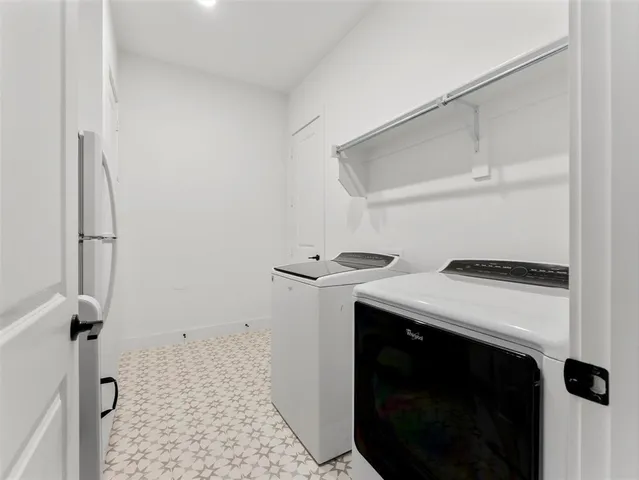 a bathroom with a granite countertop sink toilet a mirror a shower and vanity