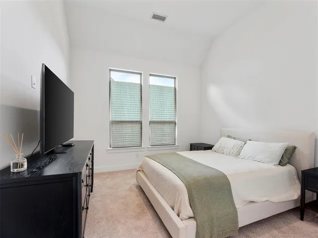 a living room with flat screen tv