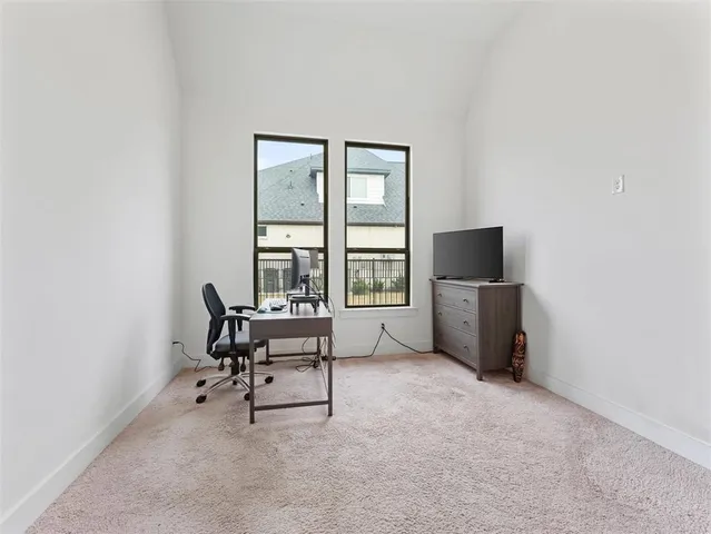 a living room with couches flat screen tv and a fireplace