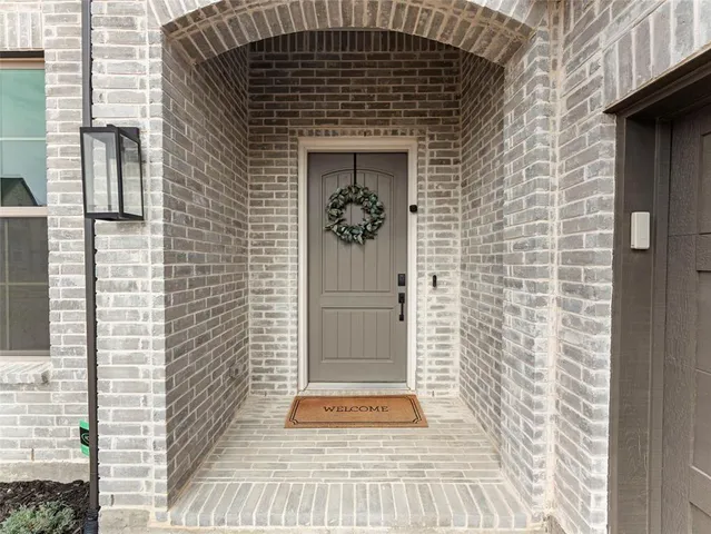 a large kitchen with stainless steel appliances kitchen island granite countertop a sink and cabinets