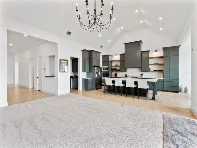 a view of a livingroom with furniture and a ceiling fan