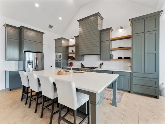 a dining room with furniture and a window