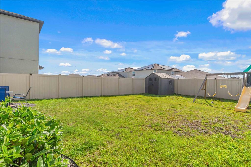 9440 Lemon Drop Loop Sun City Center, FL 33573 - Photo 51 of 55 a backyard of a house