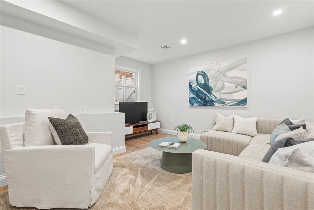 713-715 East 7th Street, Unit 715 Boston, MA 02127 - Photo 18 of 25 a living room with furniture