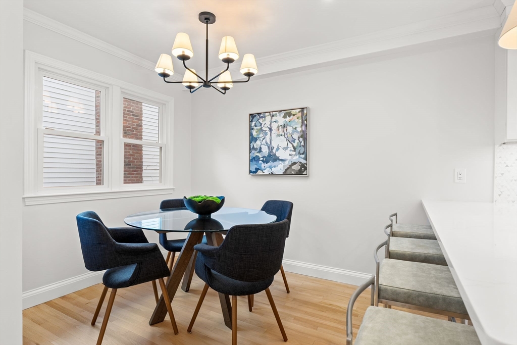 713-715 East 7th Street, Unit 715 Boston, MA 02127 - Photo 4 of 25 a dining room with furniture and window