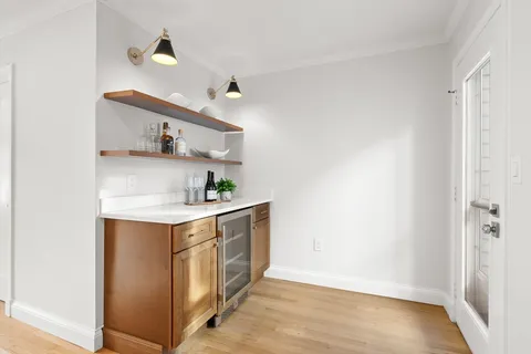 a utility room with cabinets washer and dryer