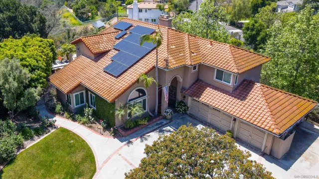 a aerial view of a house with a yard