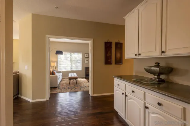 a kitchen with sink and cabinets