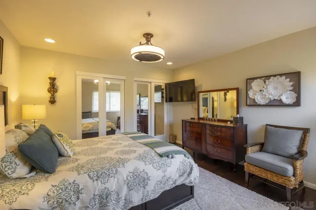 a bedroom with a bed and furniture