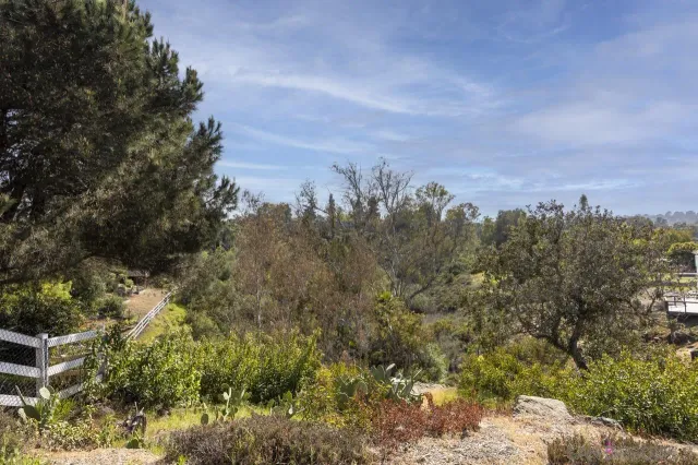 an aerial view of multiple houses with yard