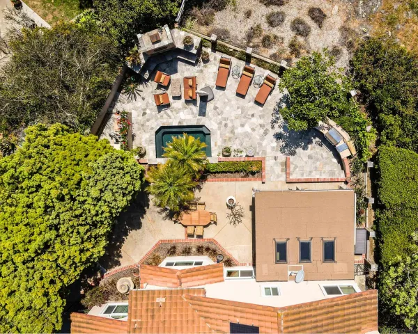 a aerial view of a house with a yard and garden