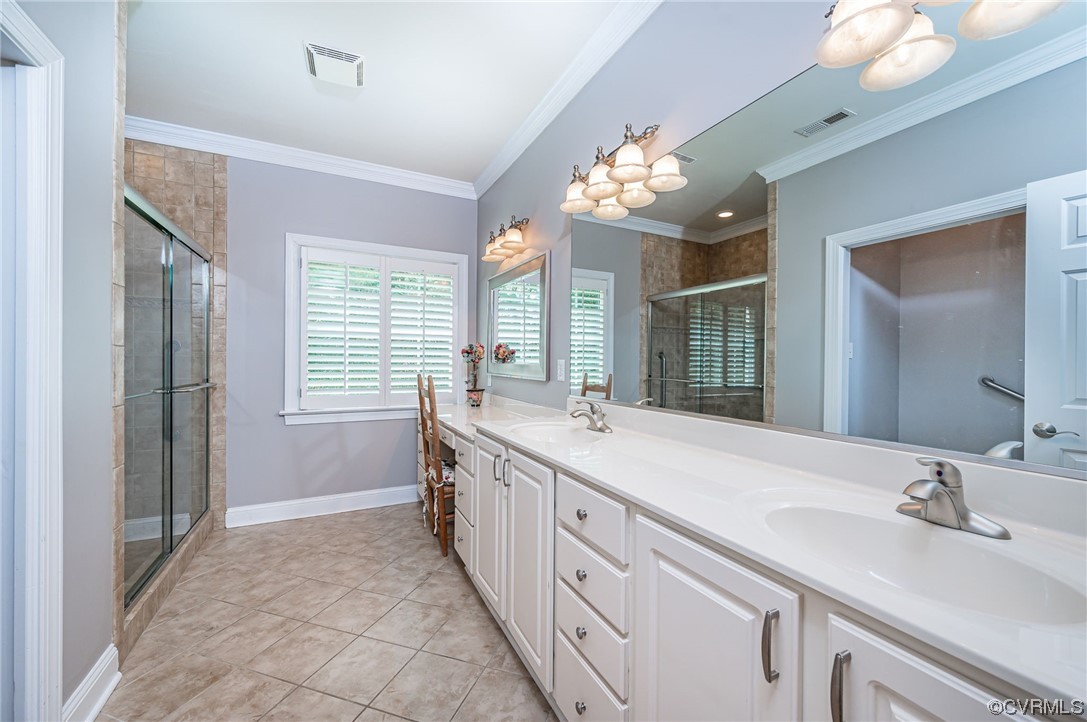 5080 Park Commons Loop Glen Allen, VA 23059 - Photo 15 of 41 a spacious bathroom with a double vanity sink mirror and next to a window