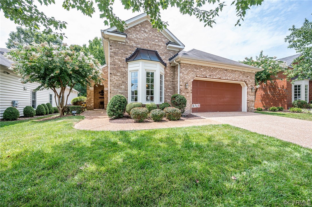 5080 Park Commons Loop Glen Allen, VA 23059 - Photo 2 of 41 a front view of a house with a yard and garage