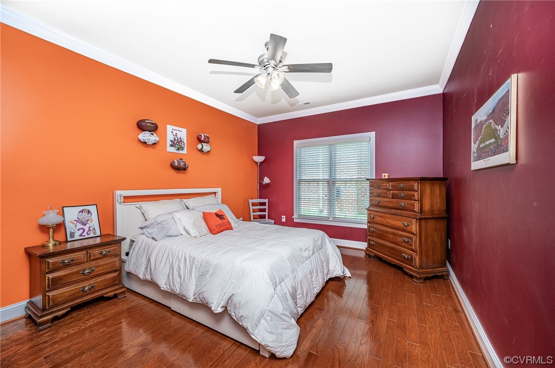 5080 Park Commons Loop Glen Allen, VA 23059 - Photo 21 of 41 a bedroom with a bed and wooden floor