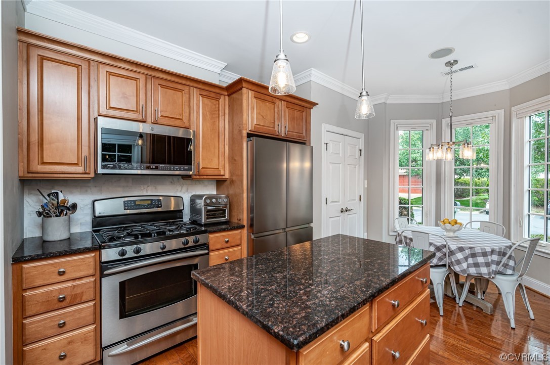 5080 Park Commons Loop Glen Allen, VA 23059 - Photo 26 of 41 a kitchen with stainless steel appliances granite countertop a stove refrigerator and microwave