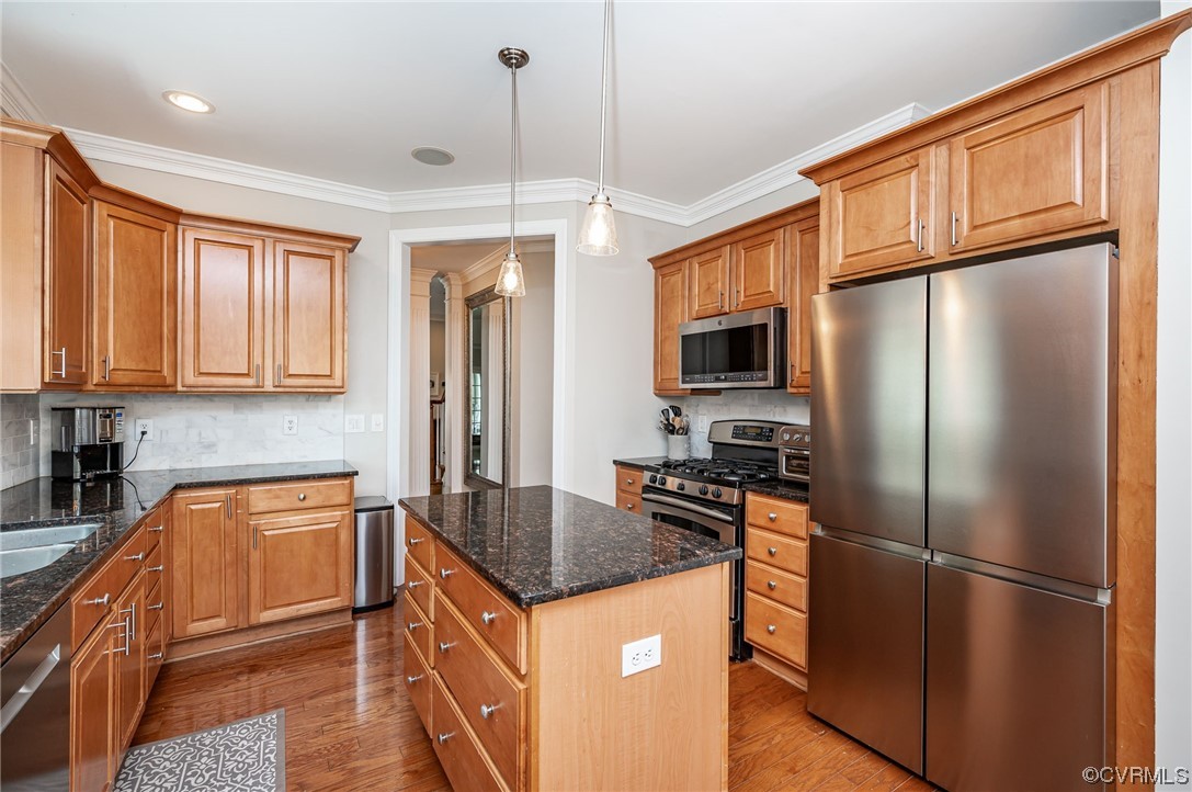5080 Park Commons Loop Glen Allen, VA 23059 - Photo 28 of 41 a kitchen with stainless steel appliances granite countertop a refrigerator a stove top oven a sink and dishwasher
