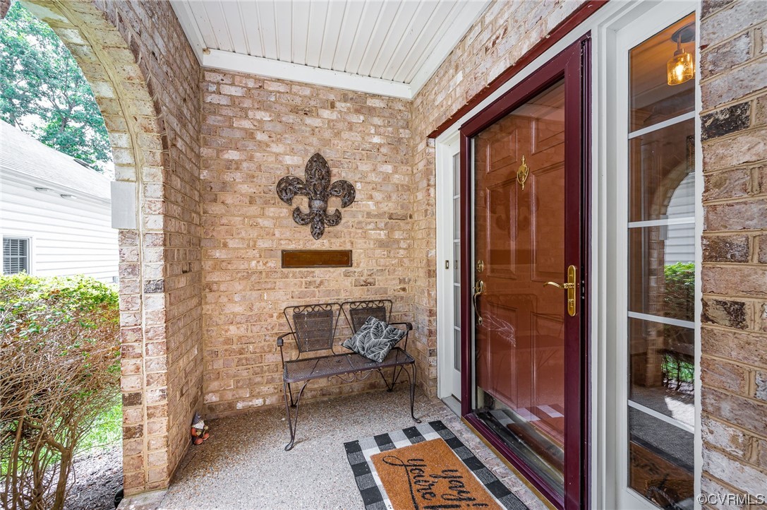 5080 Park Commons Loop Glen Allen, VA 23059 - Photo 4 of 41 a brick building with a bench in front of it
