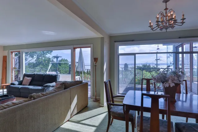 a bed sitting in a room next to a window