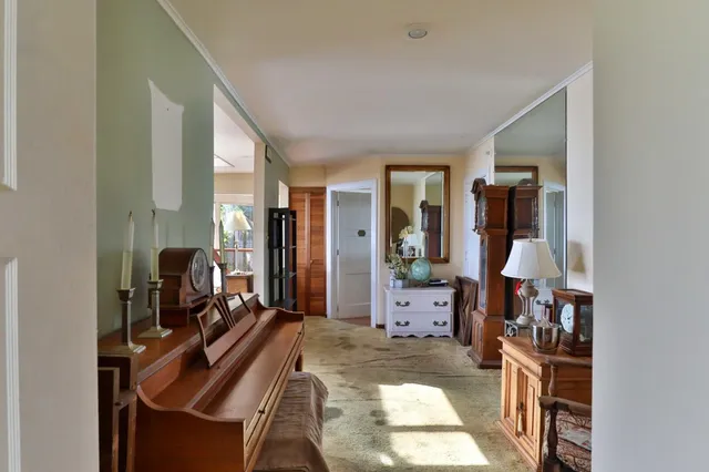 a spacious bedroom with a large bed and a large window