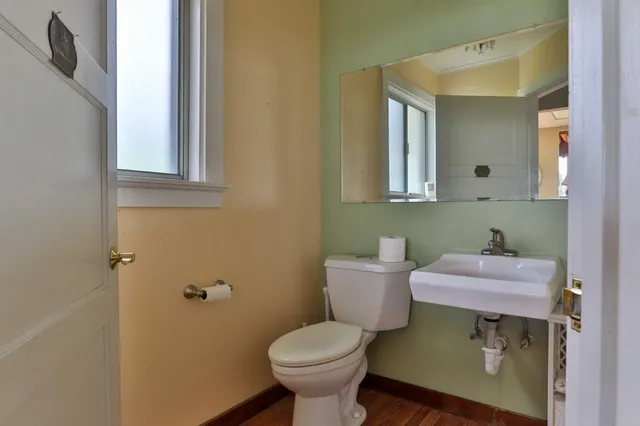 an aerial view of residential house with outdoor space and trees all around