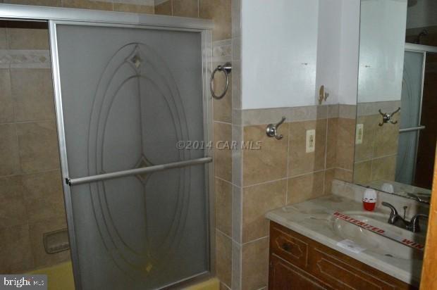 6485 Bent Pine Road Willards, MD 21874 - Photo 12 of 15 a bathroom with a shower and a sink
