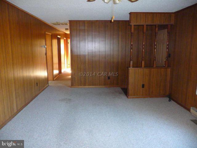 6485 Bent Pine Road Willards, MD 21874 - Photo 5 of 15 a view of an empty room with wooden walls